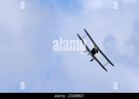 Vintage 1931 Avro 621 Tutor  biplane aircraft flying. Stock Photo