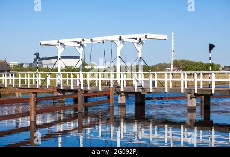 Old wooden drawbridge along the canal in Holland Stock Photo