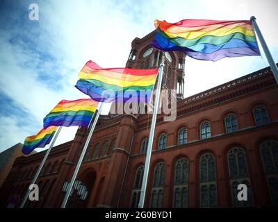 Berlin, Germany. 01st June, 2021. Flags waving in the wind at the start of the Berlin Pride summer in front of the Rotes Rathaus. Credit: XAMAX/dpa/Alamy Live News Stock Photo