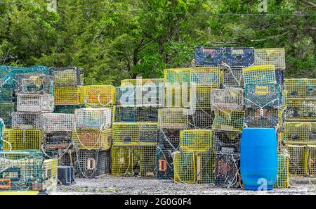 Lobster traps stacked at a marina in Three Mile Harbor Stock Photo