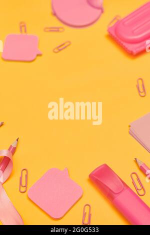 flat lay with pink school supplies and backpack isolated on pink