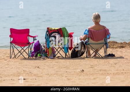 Bournemouth, Dorset UK. 2nd June 2021. UK weather: hot hazy sunshine at Bournemouth beaches, as sunseekers head to the seaside to enjoy the sunshine during Half Term.  Credit: Carolyn Jenkins/Alamy Live News Stock Photo