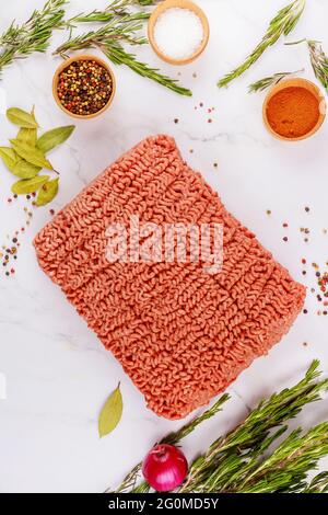 Fresh ground beef with spices, rosemary and bay leaf. Stock Photo