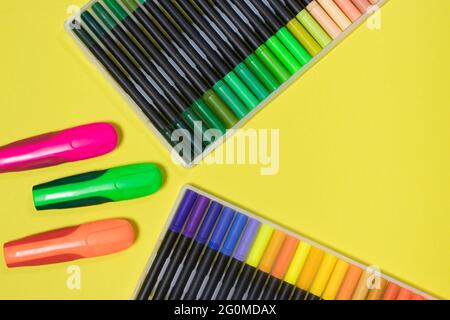 Felt pens for drawing on a yellow background with place for text. Stationery store. Stock Photo