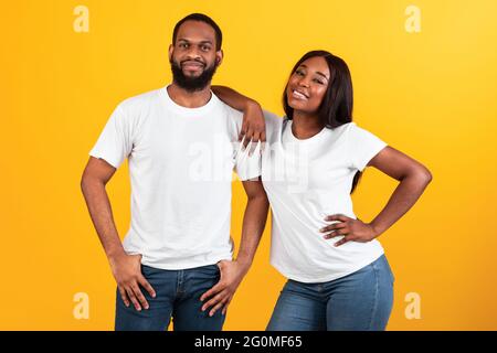 African American woman leaning on her man's shoulder at studio Stock Photo
