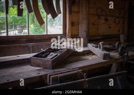 old woodworking tools laid out on a carpenters bench Stock Photo