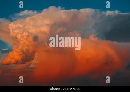 Colored air clouds in the sunset sky Stock Photo
