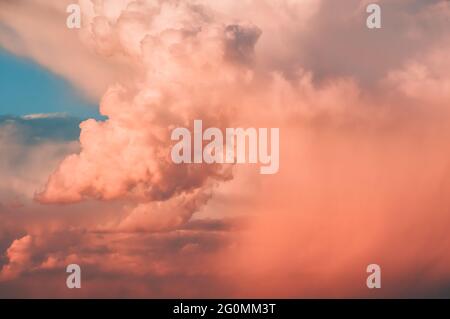 Colored air clouds in the sunset sky Stock Photo