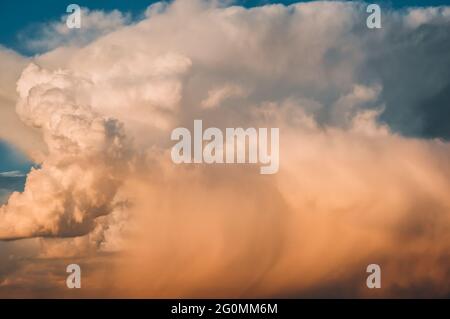 Colored air clouds in the sunset sky Stock Photo