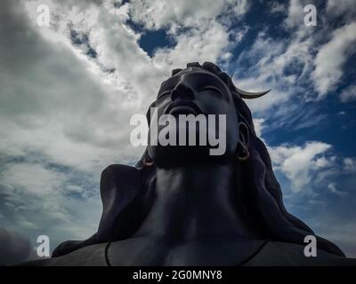 adiyogi lord shiva statue from unique different angles image is taken at coimbatore india showing the god statue in mountain and sky background. This Stock Photo