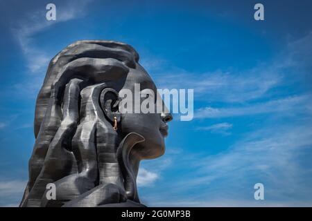 adiyogi lord shiva statue from unique different angles image is taken at coimbatore india showing the god statue in mountain and sky background. This Stock Photo