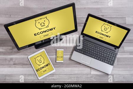 Economy concept shown on different information technology devices Stock Photo