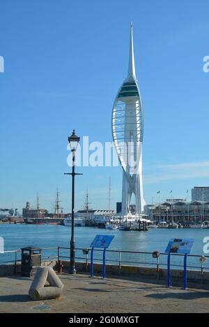 Spinnaker tower, Gunwharf quays and Portsmouth's historic dockyard viewed across the harbour from a public area in Old Portsmouth Stock Photo