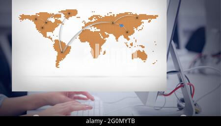 Composition of world map on interface screen over hands of woman using computer at desk in office Stock Photo