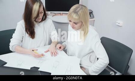 Shooting of workers discussing work in office Stock Photo