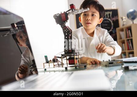Students learning robot programming Stock Photo