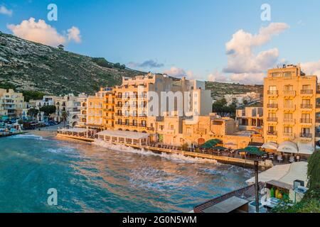 XLENDI, MALTA - NOVEMBER 9, 2017: Waterfront in Xlendi town on the island of Gozo, Malta Stock Photo