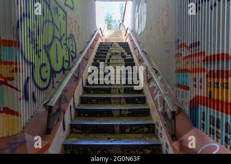 Underground passage and grafitti on the walls and stairs in Lisbon, Portugal Stock Photo