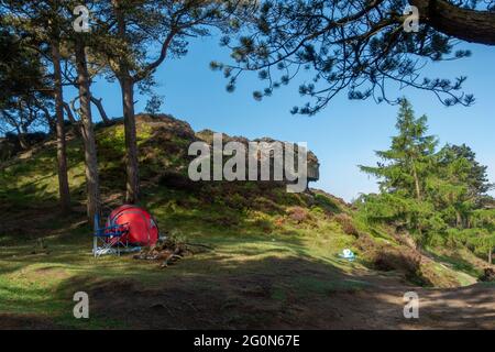 Illegal campfire, barbecue and camping on Ilkley Moor - tent with rubbish strewn everywhere - possibly from wildlife overnight. Wildfire risk UK Stock Photo