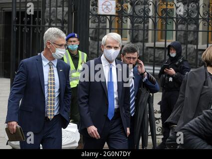 U.S. Senator Rob Portman (R-OH) (C) leaves after a press-conference with Senators Jeanne Shaheen (D-NH), and Chris Murphy (D-CT), following a meeting with the Ukrainian President Volodymyr Zelensky outside the Presidential Office building in Kiev. U.S. Senator Jeanne Shaheen (D-NH), U.S. Senator Rob Portman (R-OH) and U.S. Sen. Chris Murphy (D-CT), who are on a visit in Ukraine to reaffirm bipartisan support for Ukraine's reform agenda, as well as the fight against corruption and aggression from outside, will also meet with Prime Minister Denis Shmygal, Foreign Minister Dmytro Kuleba and Fore Stock Photo