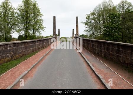 Roadbridge spanning a river in a country park Stock Photo