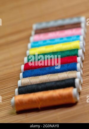 Sewing thread, spools of thread in different colors Stock Photo