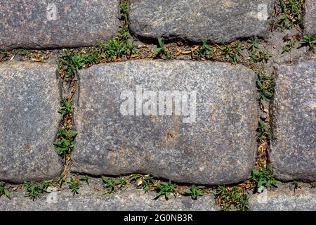 rectangle rough granite stone tile cobblestone floor of decorative patio pathway closeup top view, nobody. Stock Photo