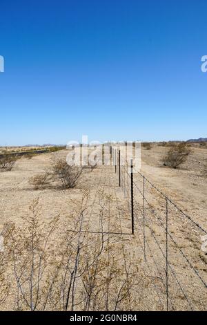 Barbed Wire Fence in the Desert Stock Photo