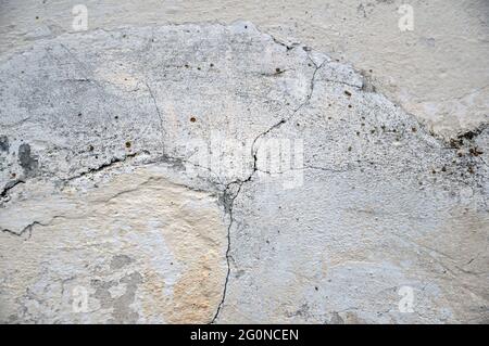 Empty old plastered wall texture. Painted problem wall surface. Crack. Stock Photo
