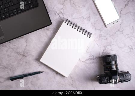 Composition of a computer, a camera, a smart phone and a notebook. Stock Photo