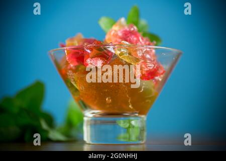 colored sweet fruit jelly in a glass glass Stock Photo