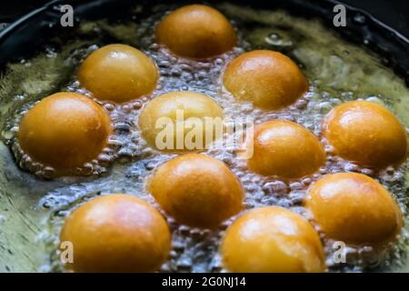 Indian sweet Gulab Jamun, a popular festival or wedding food looks ...