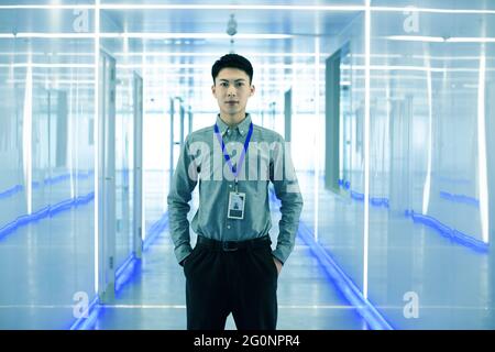 The young technical staff stood in the corridor Stock Photo