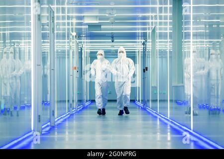 Wearing dusters of technical personnel in the hallway Stock Photo