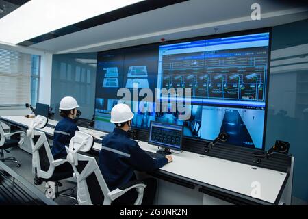 Technical personnel in the control room Stock Photo