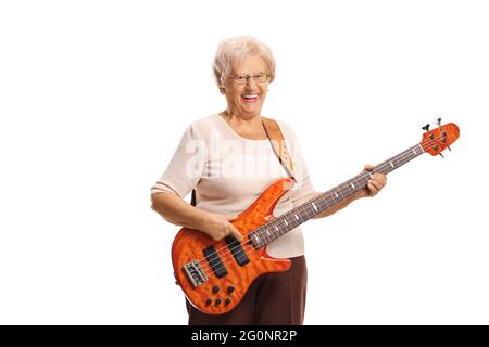 Elderly woman with an electric bass guitar smiling at the camera isolated on white background Stock Photo