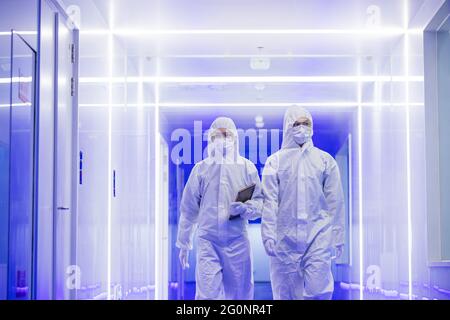 Wearing dusters of technical personnel in the hallway Stock Photo
