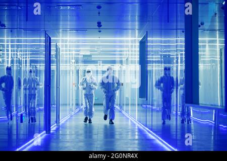 Wearing dusters of technical personnel in the hallway Stock Photo