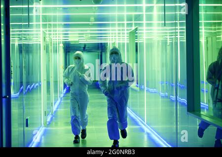 Wearing dusters of technical personnel in the hallway Stock Photo