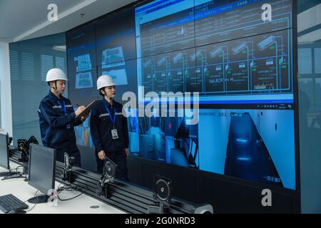 Technical personnel in the control room Stock Photo