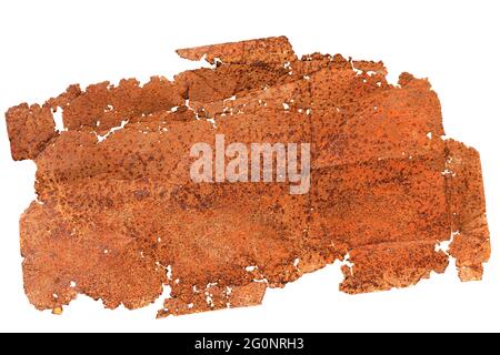 A very old piece of sheet metal, rusted through, with holes and ragged edges. Isolated on white background. Stock Photo