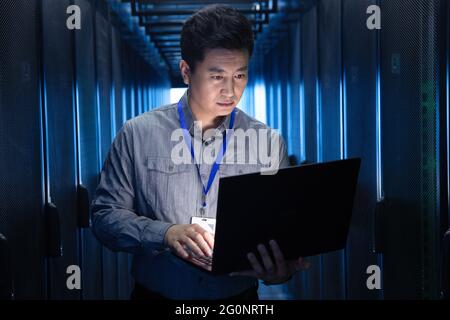 Technicians check the maintenance in the computer room Stock Photo