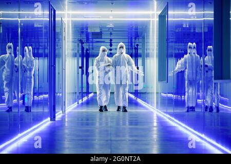 Wearing dusters of technical personnel in the hallway Stock Photo