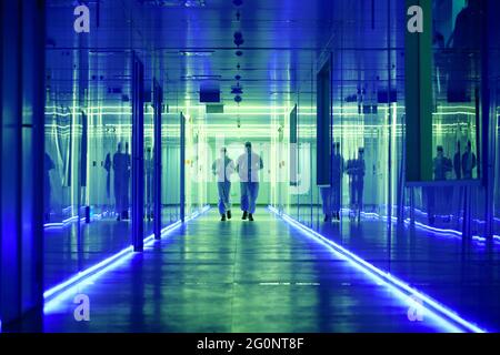 Wearing dusters of technical personnel in the hallway Stock Photo