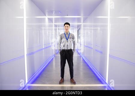 The young technical staff stood in the corridor Stock Photo
