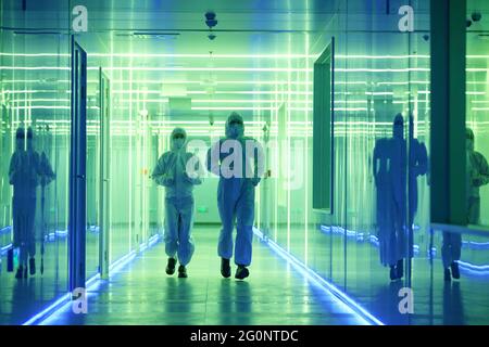 Wearing dusters of technical personnel in the hallway Stock Photo