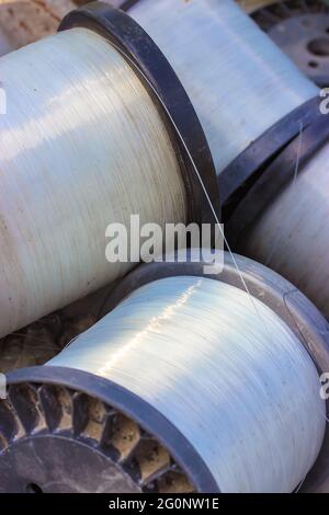Large vintage plastic spools with sturdy transparent white fishing line  close-up. Clear nylon line in roll for fishing or construction work. Fishing  t Stock Photo - Alamy