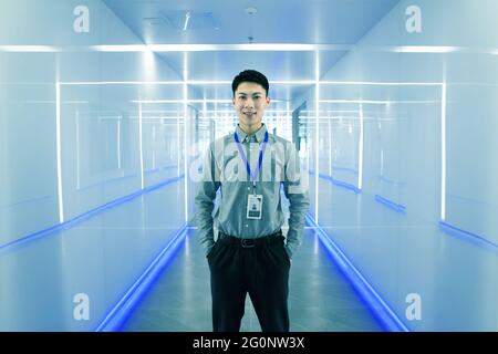 The young technical staff stood in the corridor Stock Photo