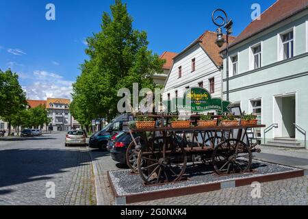 JUETERBOG, GERMANY - MAY 23, 2021: Advertisement of restaurant 'Schmied zu Juterbog' (Blacksmith at Jueterbog) in old town. Juterbog, Germany. Stock Photo
