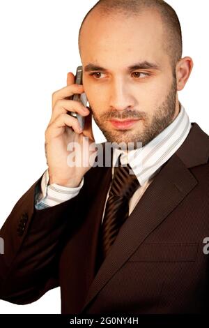 Vertical shot of a male in a suit using a phone Stock Photo